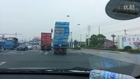 Overloaded truck almost hits traffic signs on road